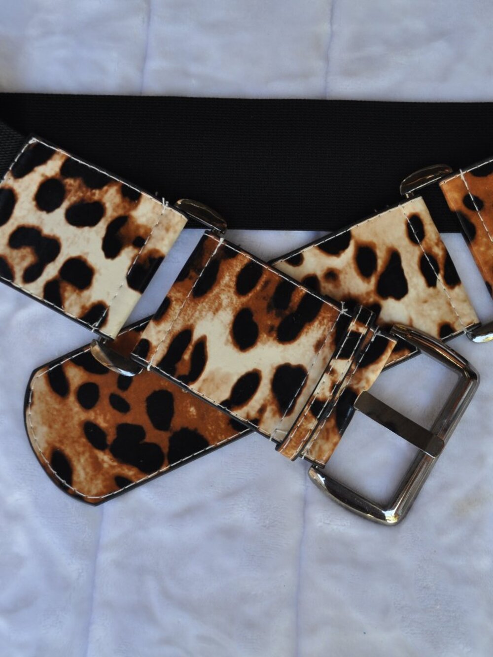 Women's wide belt features a striking leopard print pattern